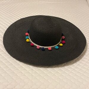 Black floppy beach hat with multicolored balls